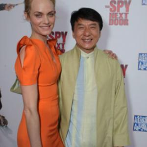 Jackie Chan and Amber Valletta at event of Kaimynas snipas 2010
