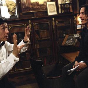JACKIE CHAN left goes over a scene with director KEVIN DONOVAN