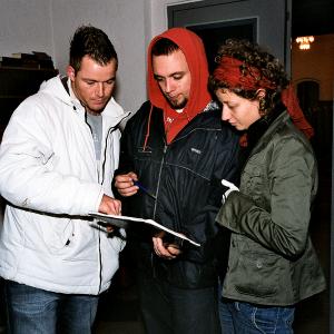 Anders Helde with 1st AD and cinematographer on the set of Kirken 2006