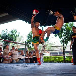 Shooting on Location Muay Thai fighting, Bankok, Thailand. Anything for the shot!