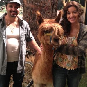 Rosie Garcia and Johnny A Sanchez on the set of Raising Hope with the Alpaca