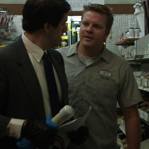 Jack Robinson as Roger and Mike Holley as the Hardware Store Clerk in Bureaucracy