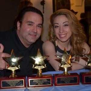 Sam Borowski (L) along with actress Samantha Tuffarelli, display the 4 awards NIGHT CLUB won at the 28th Long Island Film Festival, including Ralph Ince Best Director's Award (Borowski), Frank Currier Best Actor's Award (Ernest Borgnine), Breakout Performance (Bryan Williams) and Best Feature (Producers Sam Borowski, Sam Sherman and J. Todd Smith).