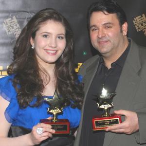 Producer Sam Borowski r displaying the Audience Choice Award he accepted for REX is flanked by actress Robin Phipps l winner of the Breakout Performance Award for Acting at the 25th Long Island Film Festival Awards
