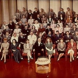 12028-1 MGM Group Photo Louis B. Mayer, Katharine Hepburn, Greer Garson, Spencer Tracy, Walter Pidgon, Robert Taylor, etc... C. 1942