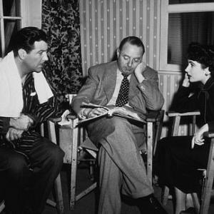 Elizabeth Taylor, director Victor Saville and Robert Taylor going over the script of 