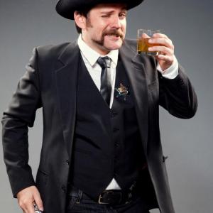 Dan as young, drunk, Wyatt Earp