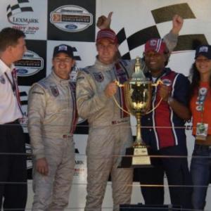 Winning Gold Cost, Queensland 2003. L-R Drivers Jimmy Vasser and Ryan Hunter-Ray, Timothy Hollywood Khan and Sabrina Champi