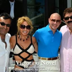 CC Perkinson attends a private celebration for Victorino Novels Foundation with artist Pitbull