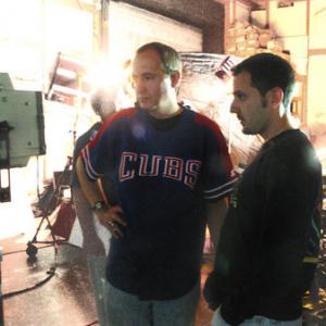 Director James P Gleason and cinematographer Nick Saglimbeni review playback on the set of Antebody