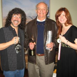Left to right Mark Bonn Ray Parker Christine Bonn Holding some of the awards In Times of War Ray Parkers Story won!