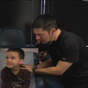 Dr Rich examines a little boy