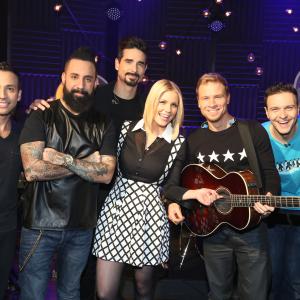 Carrie Keagan with A J McLean Howie Dorough Nick Carter Kevin Richardson and Brian Littrell from The Backstreet Boys on the set of VH1s Big Morning Buzz Live with Carrie Keagan