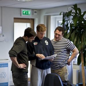 Director Max Lowenbein (left), Sam (middle) and Damien Denny (right) discuss a scene in 
