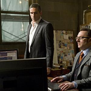 Still of Jim Caviezel and Michael Emerson in Person of Interest: Many Happy Returns (2012)