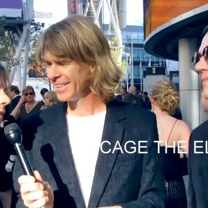 Gregory Graham aka Heavy Metal Greg interviewing Matthew Shultz and Brad Shultz of Cage the Elephant at the 2015 Grammy Awards