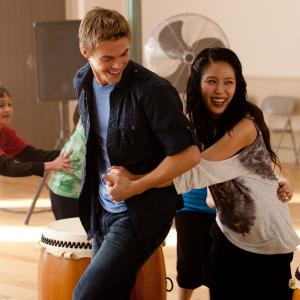 Satori red shirt with Derek Hough and BoA on set of Make Your Move
