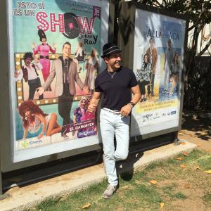 Actor-comedian Johnny Ray standing in front of his own show poster. This IS a Show 2015