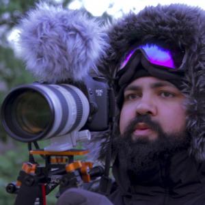 Joshua Ligairi shooting on location in Ruby, Alaska. 2012.