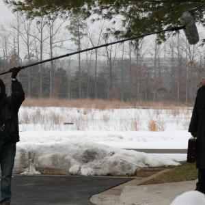 Jeff McGall fights the elements with his boom mic to prepare for the next scene with actor Richard Spencer
