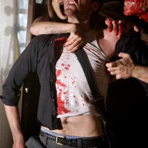 Iggy played by Zak Kilberg tries in vain to hold back a zombie attack