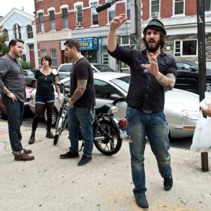 Michael Jasionowski outside of Greenpoint Tattoo directing the music video for Brooklyn Dodgers by I Am the Avalanche
