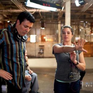 Sara Geralds talking over shots with director Daniel Chavez on the set of 