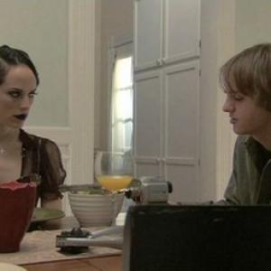 Mackenzie Firgens and Cory Knauf in The Hamiltons (2006)
