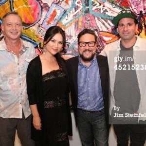 LOS ANGELES - JULY 10: Artist Danny Minnick at his art exhibit poses with John Murray, Patti Schneider, and John Schneider at Gallerie Sparta in Los Angeles, California on July 10, 2014.