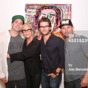 LOS ANGELES  JULY 10 Artist Danny Minnick at his art exhibit poses with Marylin Hassett Johnny Whitworth and Fabian Alomar at Gallerie Sparta in Los Angeles California on July 10 2014