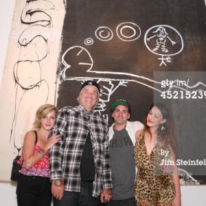 LOS ANGELES - JULY 10: Artist Danny Minnick at his art exhibit poses with Sasha Cassavetes, Nick Cassavetes, and Gina Cassavetes at Gallerie Sparta in Los Angeles, California on July 10, 2014.