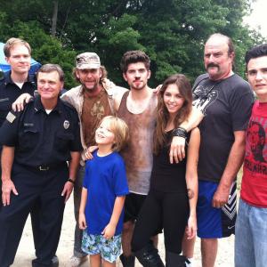 Jayson Warner Smith as Mickey in Heavy Water with L to R Mark Knapp Alex Van Wes Watson Carter Jenkins Sidney Allison Jake The Snake Roberts and Chris Marrone