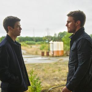 Still of Stephen Amell and Grant Gustin in The Flash 2014