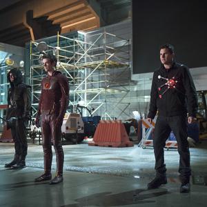 Still of Stephen Amell Robbie Amell and Grant Gustin in The Flash 2014
