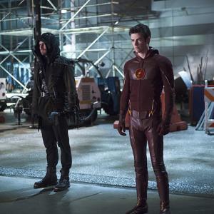 Still of Stephen Amell and Grant Gustin in The Flash 2014
