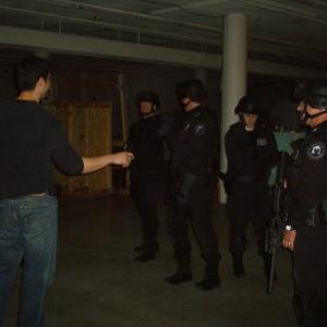Jin Kelley choreographing SWAT Team Raid on set