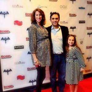 Tom on the red carpet premiere of Caped Crusader: The Dark Hours film with his girlfriend Amy and his daughter Gianna.