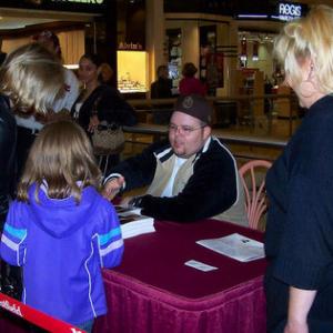 Scott signing autographs  Southpark Mall Concert Strongsville OH 111305!