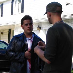 Writer and director Adrian Langley and Matthew Stefiuk Don Keys discuss a scene on location