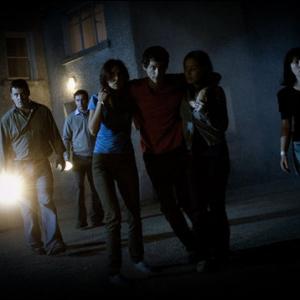 Declan Reynolds as James Conroy with torch with other cast members in the horror film SEER 2008 httpwwwseerthemoviecom