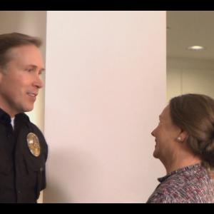 Dwight Turner as Officer Burt Smith and Rosemary Stevens as Laury in Drunk and Disorderly 2015