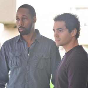 Still of RZA and Ramon Rodriguez in Gang Related (2014)