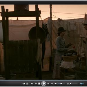 Carnivale HBO Ep 2.2. Sofie is watching the Carnies do laundry. Rebecca Flahning and Laura Ann Tull as Carnivale Wives