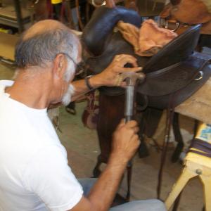 Repairing a friends saddle during some down time Cant just sit around doing nothing