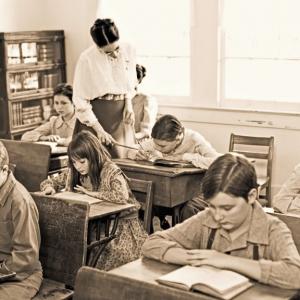A classroom scene set in the early 1900s