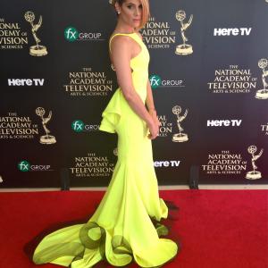 Tiffany Michelle wearing Michael Costello attends the 41st Annual Daytime Emmy Awards with the nominated cast of DeVanity.