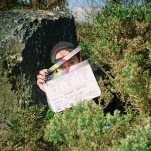 Shawn with the clapperboard on location.