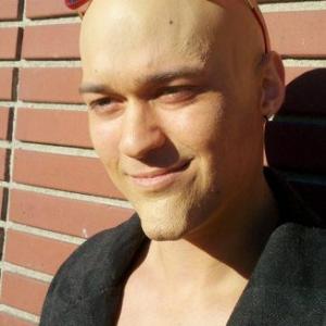 Tristan Ott with bald cap and chin prosthetic