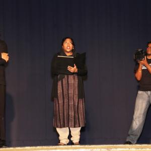 On stage as Mrs Khan in Bollywood Filmmaking skit for Buttahflap 20 West Indian sketch comedy show directed by Frankie Sooknanan with Prakash Brahaspat l and Dinesh Khemraj r