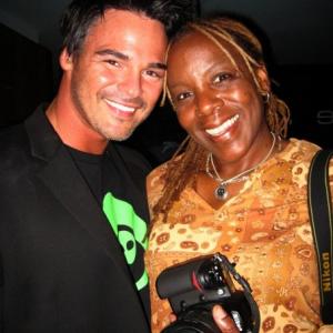 Actor Chris Winters and photographer Koi Sojer caught at an event